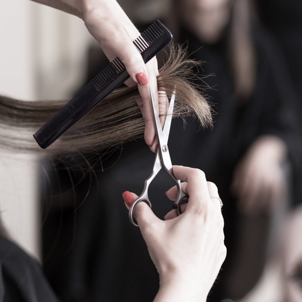 Hairdresser cutting hair